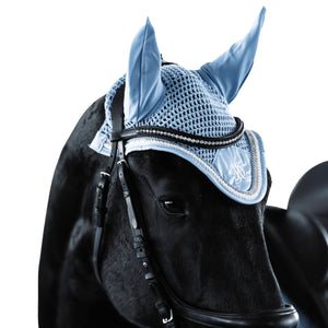
                  
                    Blue fly veil with matching blue, white and diamante trim, modelled on a black friesian horse, on a white background.
                  
                