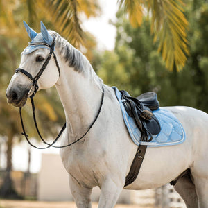 
                  
                    Matching light blue saddle pad and fly veil, modelled on a grey horse.
                  
                